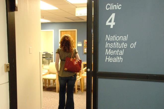 Back of woman who is standing in the national institute of mental health clinic